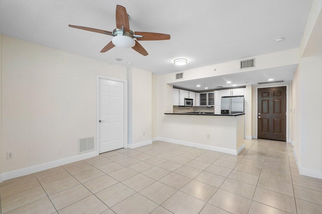 610 Clematis St Unit 236, West Palm Beach, FL 33401 - unfurnished living room featuring a ceiling fan, light tile patterned flooring, recessed lighting, and baseboards