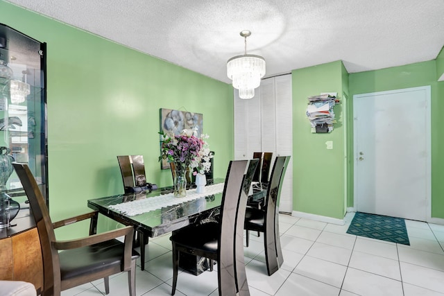2029 NW 46th Ave Unit E204, Lauderhill, FL 33313 - dining room featuring a chandelier, a textured ceiling, baseboards, and light tile patterned floors