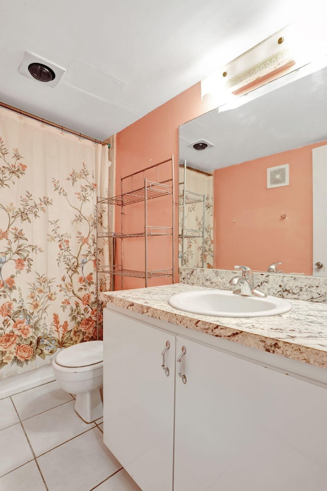 2029 NW 46th Ave Unit E204, Lauderhill, FL 33313 - bathroom featuring vanity, toilet, tile patterned flooring, and a shower with shower curtain