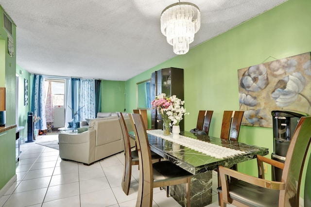 2029 NW 46th Ave Unit E204, Lauderhill, FL 33313 - dining room featuring a chandelier, a textured ceiling, and tile patterned flooring