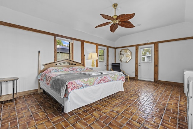 14601 Orange Ave, Fort Pierce, FL 34945 - bedroom featuring baseboards, vaulted ceiling, brick patterned flooring, and ceiling fan