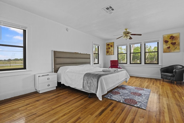 14601 Orange Ave, Fort Pierce, FL 34945 - bedroom with hardwood / wood-style floors, baseboards, and ceiling fan