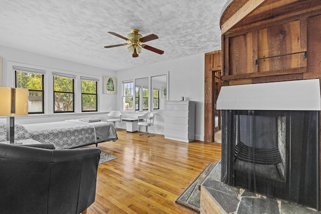 14601 Orange Ave, Fort Pierce, FL 34945 - living room with a ceiling fan, light wood-style flooring, and a textured ceiling