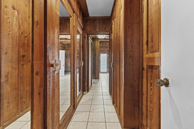 14601 Orange Ave, Fort Pierce, FL 34945 - corridor featuring light tile patterned floors and wood walls