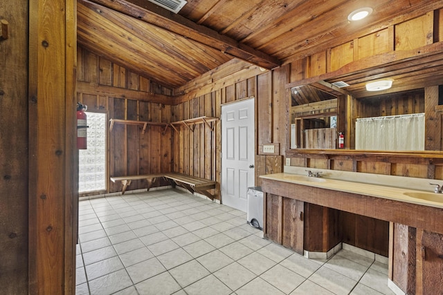 14601 Orange Ave, Fort Pierce, FL 34945 - interior space with vaulted ceiling, tile patterned floors, double vanity, wooden ceiling, and wood walls