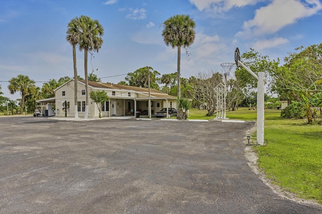 14601 Orange Ave, Fort Pierce, FL 34945 - view of front of home featuring uncovered parking and a front lawn