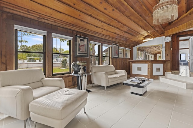 14601 Orange Ave, Fort Pierce, FL 34945 - living area with wooden walls, vaulted ceiling, wood ceiling, and light tile patterned floors