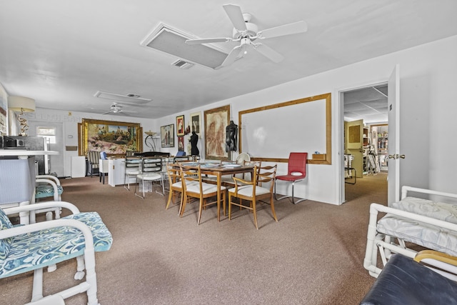 14601 Orange Ave, Fort Pierce, FL 34945 - carpeted dining area featuring attic access and a ceiling fan