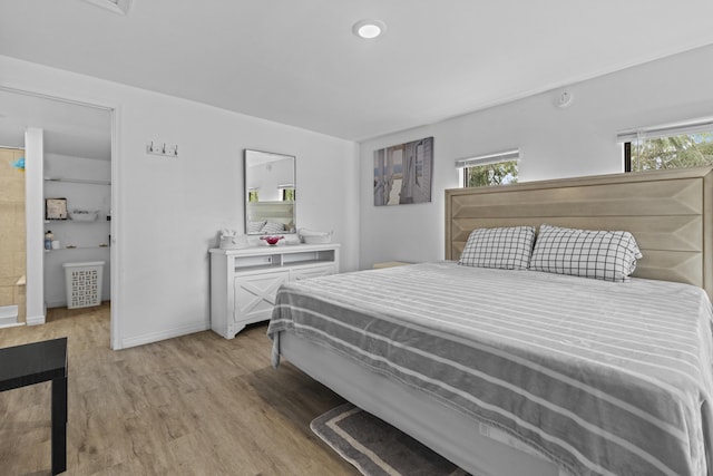 14601 Orange Ave, Fort Pierce, FL 34945 - bedroom featuring light wood-style floors and baseboards