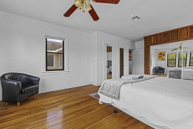 14601 Orange Ave, Fort Pierce, FL 34945 - bedroom featuring hardwood / wood-style flooring, baseboards, and a ceiling fan
