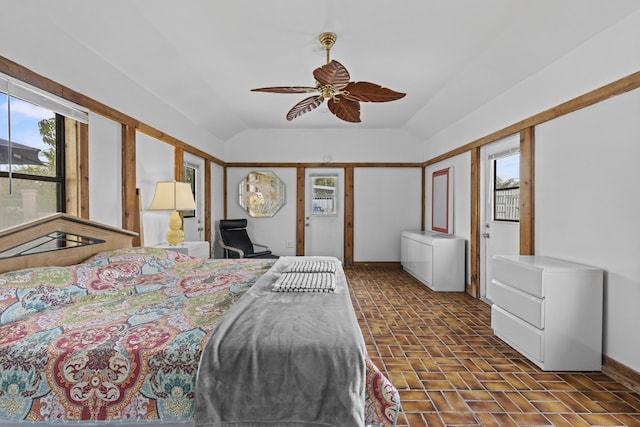 14601 Orange Ave, Fort Pierce, FL 34945 - bedroom featuring multiple windows, lofted ceiling, baseboards, and ceiling fan