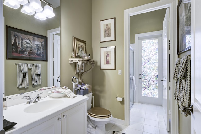 1081 Vintner Blvd, Palm Beach Gardens, FL 33410 - bathroom with tile patterned floors, toilet, a shower with shower door, baseboards, and healthy amount of natural light
