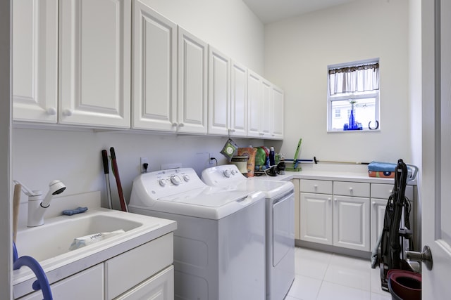 1081 Vintner Blvd, Palm Beach Gardens, FL 33410 - laundry room featuring cabinet space, washer and clothes dryer, and light tile patterned floors