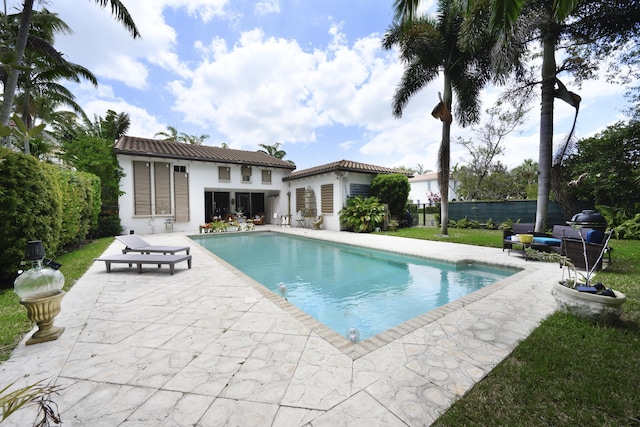 1081 Vintner Blvd, Palm Beach Gardens, FL 33410 - view of pool with a patio, an outbuilding, and an exterior structure