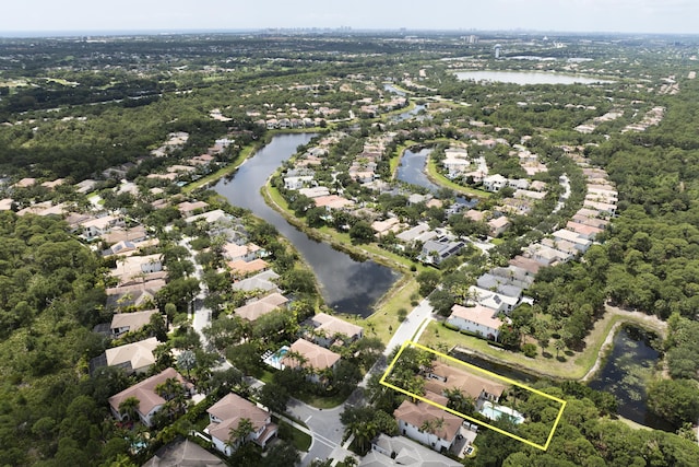 1081 Vintner Blvd, Palm Beach Gardens, FL 33410 - aerial perspective of suburban area with a large body of water and property parcel outlined