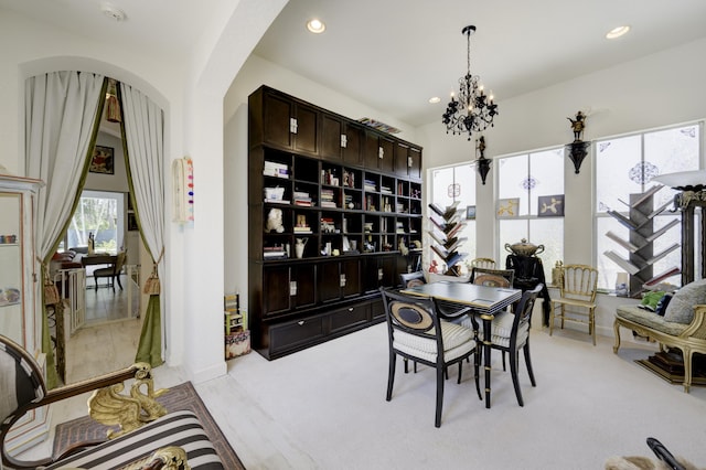 1081 Vintner Blvd, Palm Beach Gardens, FL 33410 - dining area featuring a chandelier, recessed lighting, light carpet, and arched walkways