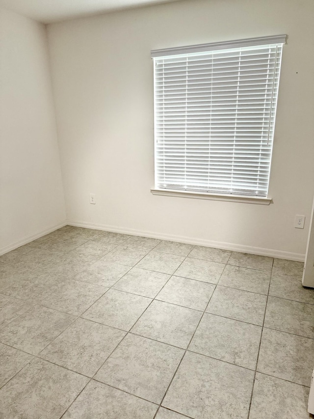 763 SE Evergreen Ter, Port Saint Lucie, FL 34983 - unfurnished room featuring light tile patterned flooring and baseboards