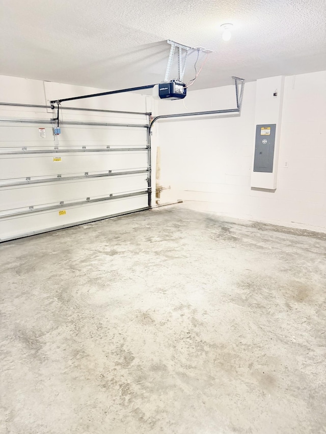 763 SE Evergreen Ter, Port Saint Lucie, FL 34983 - garage featuring electric panel and a garage door opener