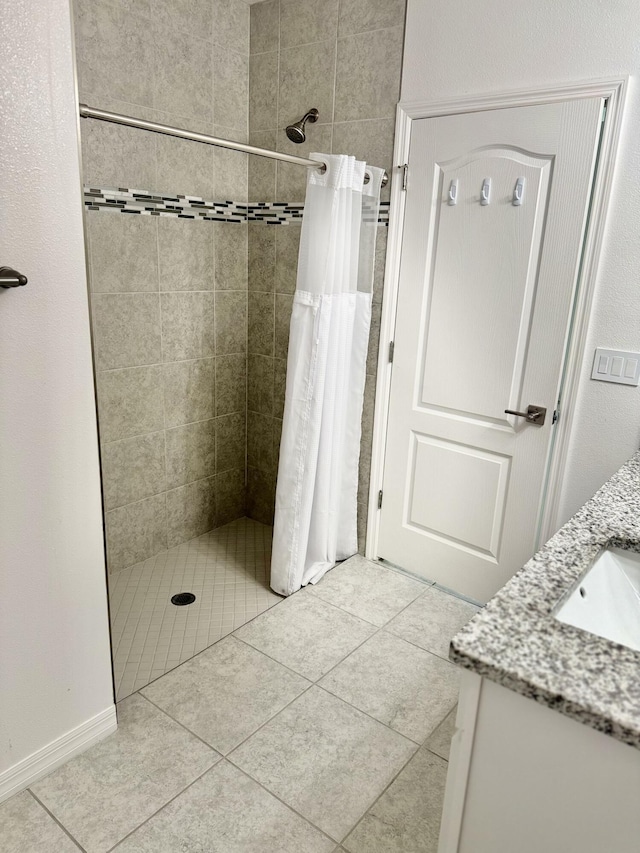 763 SE Evergreen Ter, Port Saint Lucie, FL 34983 - bathroom with a shower stall, vanity, and tile patterned flooring