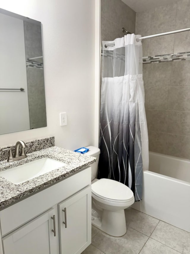 763 SE Evergreen Ter, Port Saint Lucie, FL 34983 - bathroom featuring toilet, tile patterned flooring, vanity, and shower / bath combo