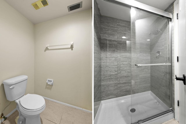 1631 SE Green Acres Cir Unit Bb103, Port Saint Lucie, FL 34952 - bathroom with toilet, baseboards, a shower stall, and tile patterned floors