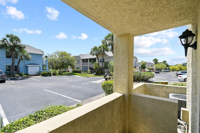 1631 SE Green Acres Cir Unit Bb103, Port Saint Lucie, FL 34952 - balcony featuring a residential view and cooling unit
