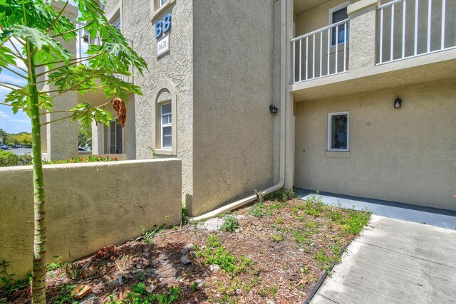 1631 SE Green Acres Cir Unit Bb103, Port Saint Lucie, FL 34952 - view of home's exterior featuring stucco siding