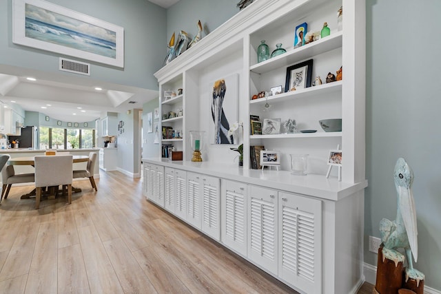 17166 Waterbend Dr Unit 210, Jupiter, FL 33477 - detailed view of freestanding refrigerator, wood finished floors, and baseboards