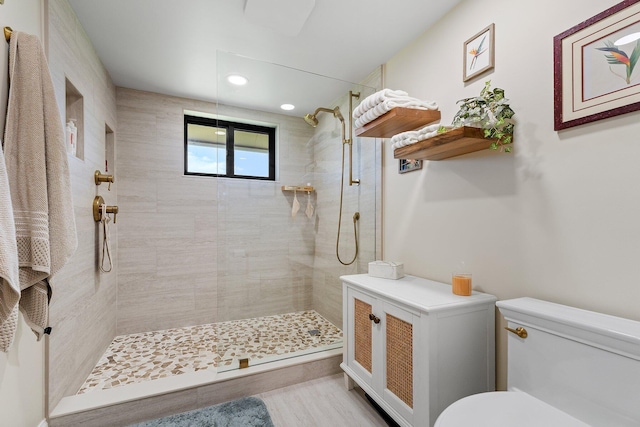 17166 Waterbend Dr Unit 210, Jupiter, FL 33477 - bathroom featuring toilet, tiled shower, recessed lighting, and wood finished floors