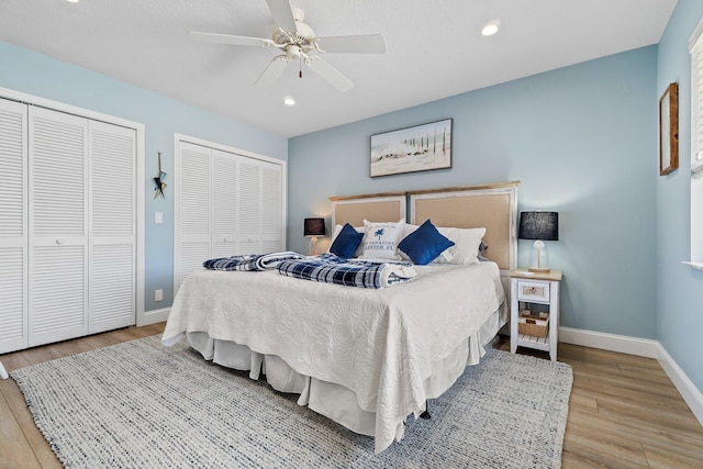 17166 Waterbend Dr Unit 210, Jupiter, FL 33477 - bedroom with two closets, baseboards, wood finished floors, recessed lighting, and a ceiling fan