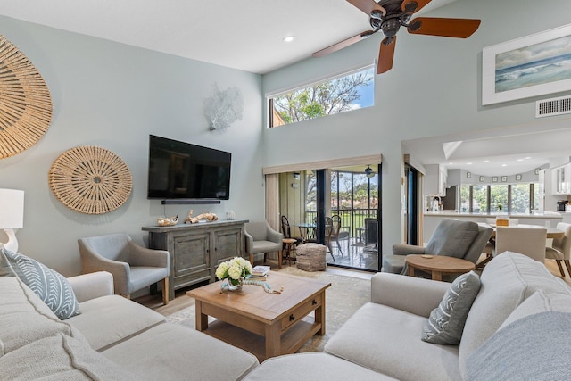 17166 Waterbend Dr Unit 210, Jupiter, FL 33477 - living area with ceiling fan, a towering ceiling, and recessed lighting
