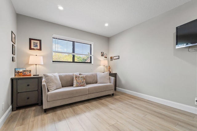 17166 Waterbend Dr Unit 210, Jupiter, FL 33477 - living room featuring light wood-style flooring, baseboards, and recessed lighting