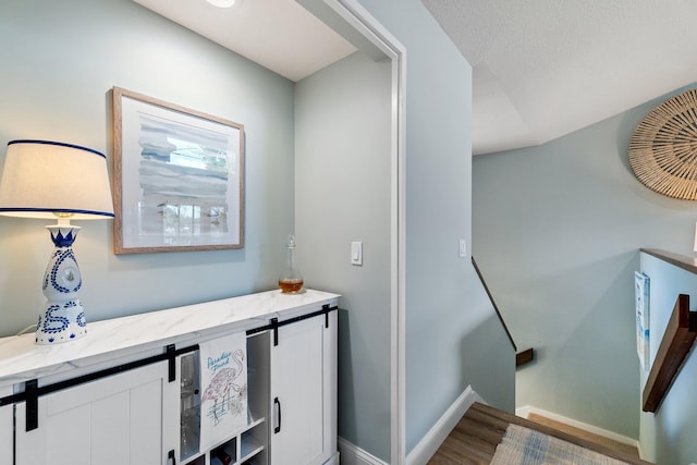 17166 Waterbend Dr Unit 210, Jupiter, FL 33477 - bathroom with baseboards and wood finished floors