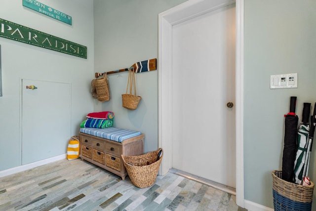 17166 Waterbend Dr Unit 210, Jupiter, FL 33477 - mudroom featuring wood finished floors and baseboards