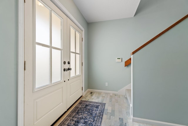 17166 Waterbend Dr Unit 210, Jupiter, FL 33477 - entrance foyer featuring baseboards and light wood-type flooring