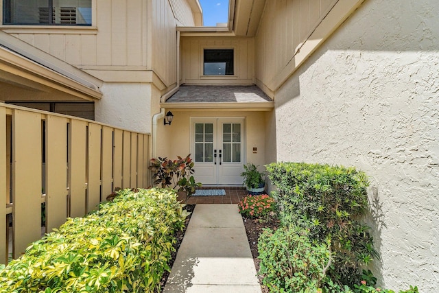 17166 Waterbend Dr Unit 210, Jupiter, FL 33477 - doorway to property with french doors and stucco siding