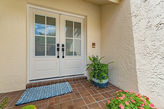 17166 Waterbend Dr Unit 210, Jupiter, FL 33477 - doorway to property with french doors and stucco siding