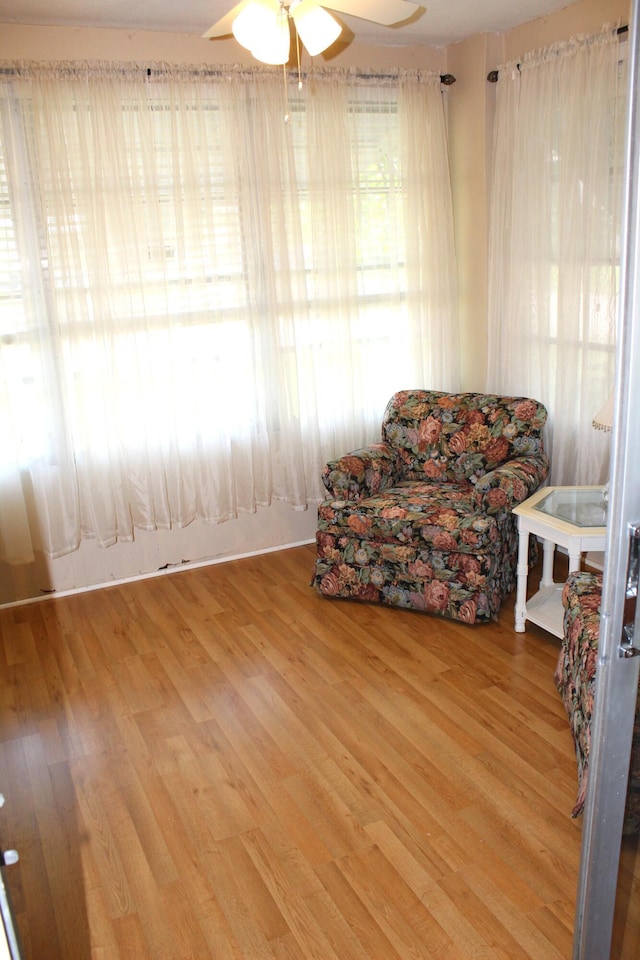 540 High Point Dr Unit A, Delray Beach, FL 33445 - sitting room with a ceiling fan and wood finished floors