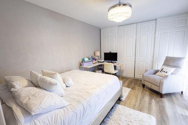 1515 Augusta Cir Unit 116, Delray Beach, FL 33445 - bedroom featuring a chandelier, wood finished floors, and a closet