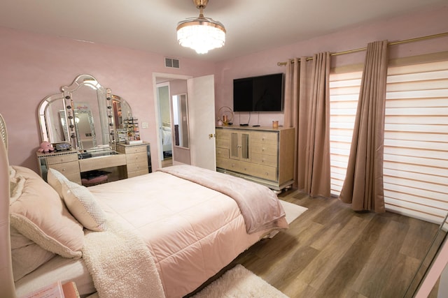 1515 Augusta Cir Unit 116, Delray Beach, FL 33445 - bedroom with wood finished floors and a chandelier