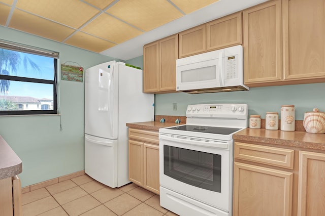 7430 S Ocean Dr Unit 319, Jensen Beach, FL 34957 - kitchen with white appliances, light brown cabinetry, light tile patterned floors, and light countertops