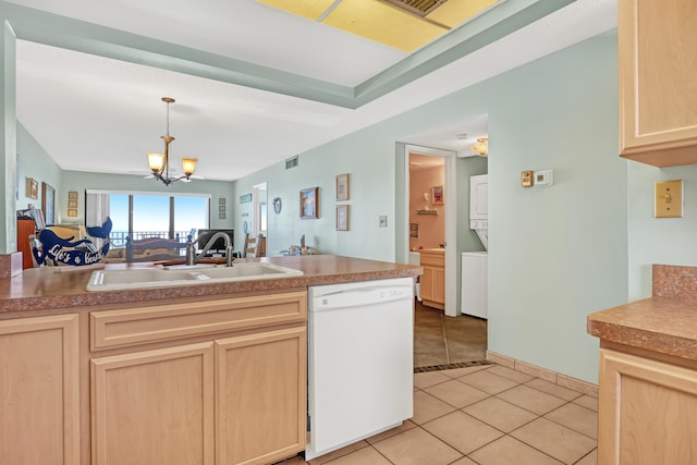 7430 S Ocean Dr Unit 319, Jensen Beach, FL 34957 - kitchen featuring white dishwasher, a sink, light brown cabinetry, and open floor plan