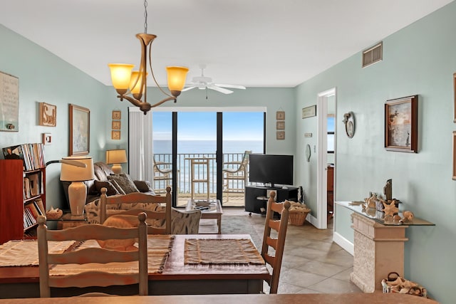 7430 S Ocean Dr Unit 319, Jensen Beach, FL 34957 - dining area featuring ceiling fan, light tile patterned floors, and baseboards