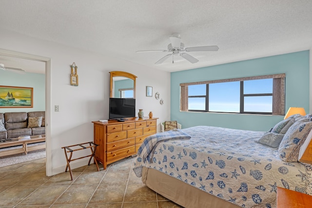 7430 S Ocean Dr Unit 319, Jensen Beach, FL 34957 - bedroom with a ceiling fan and a textured ceiling
