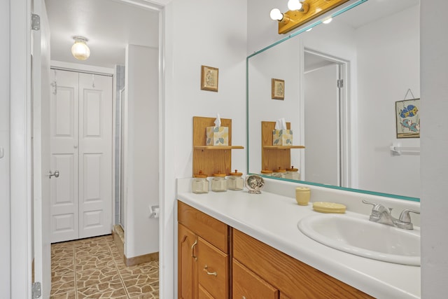 7430 S Ocean Dr Unit 319, Jensen Beach, FL 34957 - full bathroom with vanity, a shower stall, a closet, and baseboards