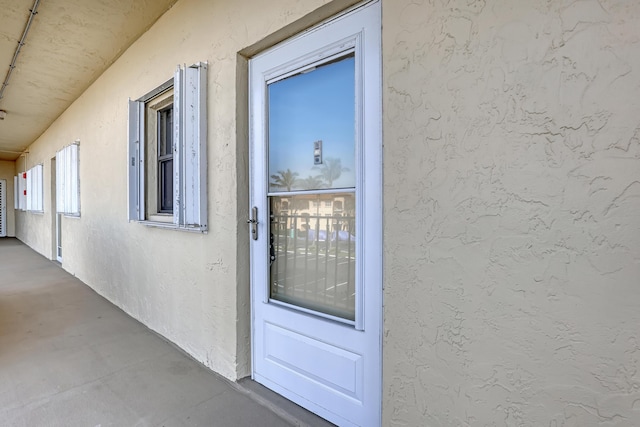 7430 S Ocean Dr Unit 319, Jensen Beach, FL 34957 - doorway to property with stucco siding