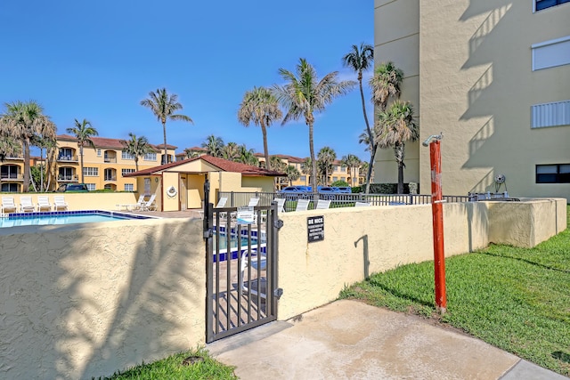 7430 S Ocean Dr Unit 319, Jensen Beach, FL 34957 - surrounding community with a pool, a residential view, and a patio