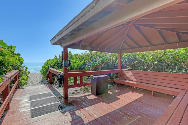 7430 S Ocean Dr Unit 319, Jensen Beach, FL 34957 - wooden deck with view of water and beach and a gazebo