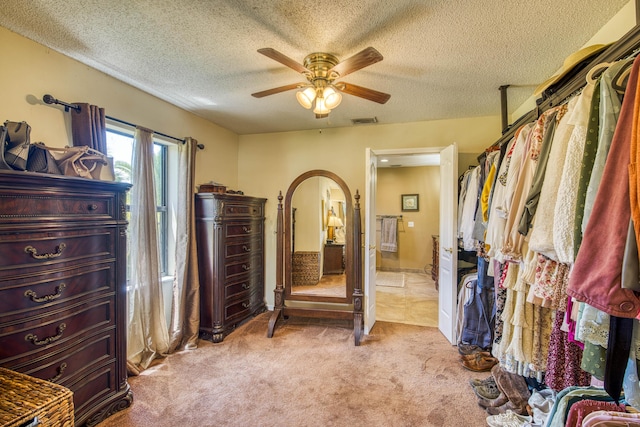 11033 67th Pl N, The Acreage, FL 33412 - bedroom with light colored carpet, arched walkways, a textured ceiling, and ceiling fan