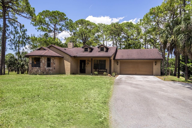11033 67th Pl N, The Acreage, FL 33412 - view of front of property featuring asphalt driveway, a chimney, a front yard, and an attached garage